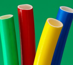 Co-extruded foam PVC liner with coloured skin